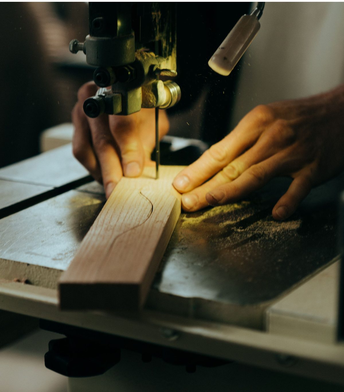 Curved cut being made in a timber strip
